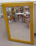 Finished to the customers color and satin lacquer, the mirror was remounted with a new backing and delivered.