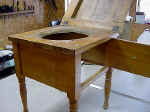 A childs antique commode door before repairs.
