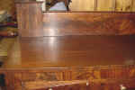 An antique sideboard top closeup after repairs.