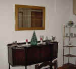 Finished to the customers color and satin lacquer, the mirror was remounted with a new backing and hung in place.