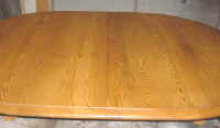 Only half the table was stripped, then a matching stain was applied and a finish was reapplied to make the whole table like new. A perfect match.
