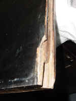 This  armoire door inside, left side damage.